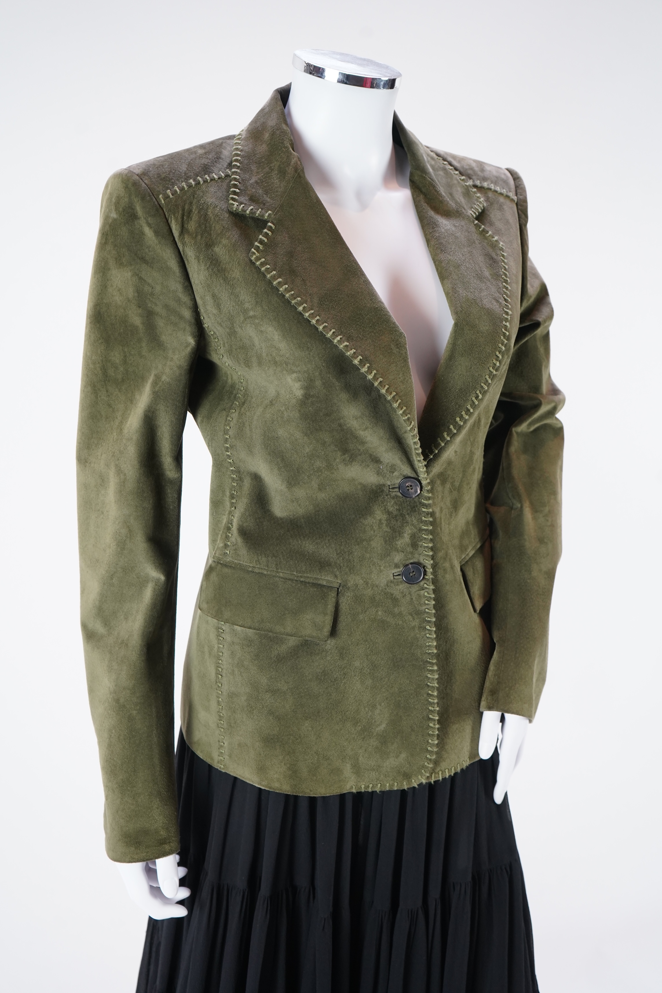 A lady's Yves Saint Laurent olive green suede jacket with stitching details and a black YSL (label missing) gypsy skirt with underskirt. IT 38 (UK size 10)